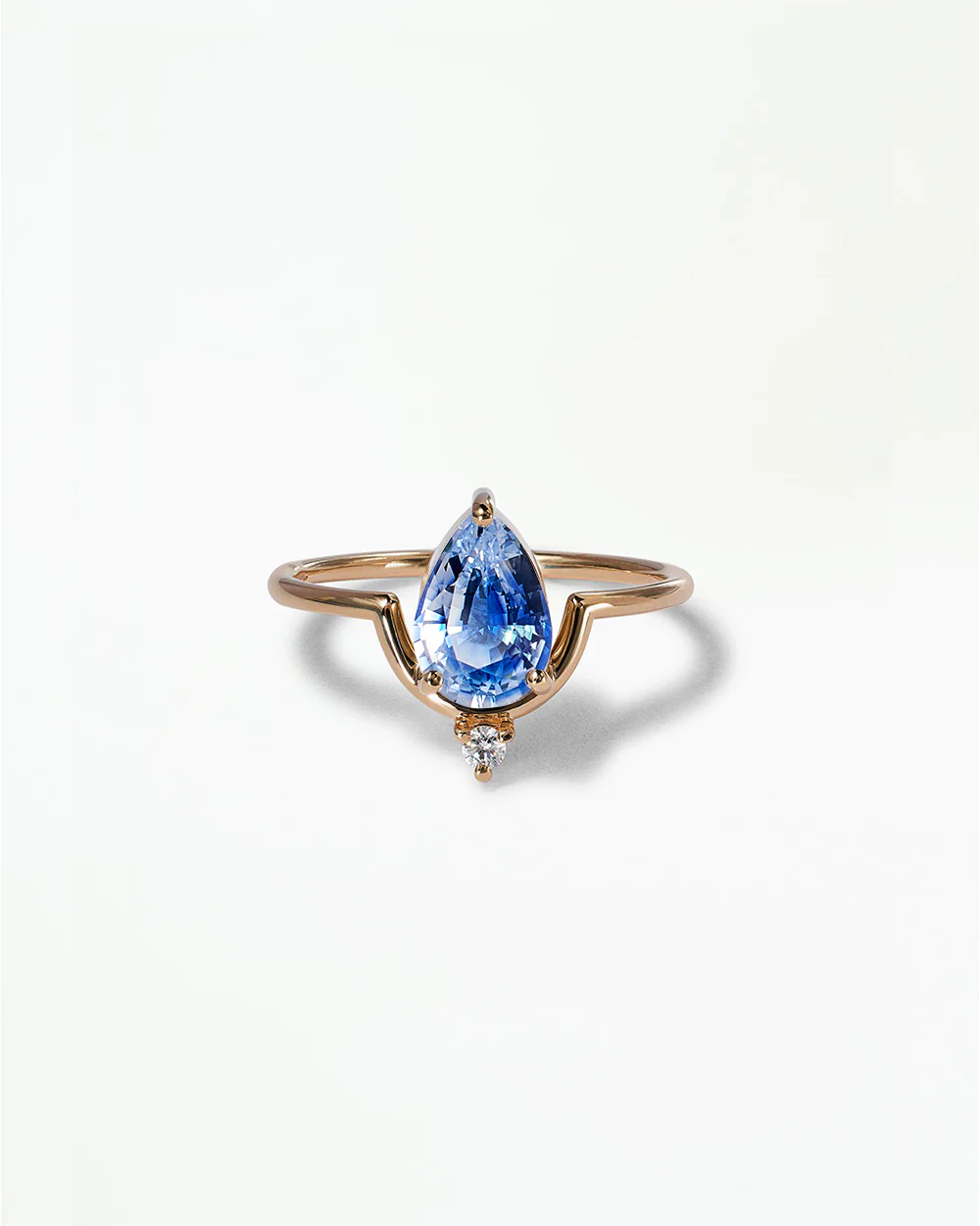 Pear Cut Sapphire Nestled Ring